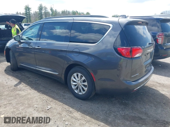 2017 Chrysler Pacifica Touring L with VIN 2C4RC1BGXHR667397, listed as a IAAI auction lot 42085117 with 63,996 mi miles and . Bid and sale history available at DreamBid. Image 3.