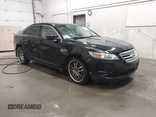 2011 Ford Taurus SEL with VIN 1FAHP2EW4BG160633, listed as a IAAI auction lot 41778406 with 125,934 mi miles. Bid and sale history available at carsss.com. Image 1.