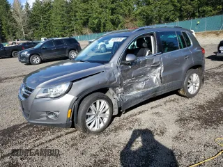 2011 Volkswagen Tiguan SE with VIN WVGBV7AX3BW519960, listed as a Copart auction lot 48063075 with 128,490 mi miles and Salvage title. Bid and sale history available at DreamBid. Image 1.