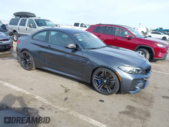 2018 BMW M2 with VIN WBS1J5C50JVE51869, listed as a IAAI auction lot 41814404 with 69,684 mi miles. Bid and sale history available at carsss.com. Image 1.