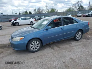2002 Toyota Camry XLE z VIN 4T1BF32K12U522103, wystawiony jako IAAI lot #42047263 z przebiegiem 293 503 mil mil oraz . Historia ofert i sprzedaży dostępna na DreamBid. Obrazek 2.