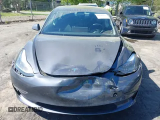 2023 Tesla Model 3 with VIN 5YJ3E1EA6PF645110, listed as a IAAI auction lot 42044357 with 24,352 mi miles and . Bid and sale history available at DreamBid. Image 12.