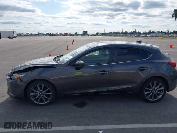 2018 Mazda 3 Touring with VIN 3MZBN1L32JM268582, listed as a IAAI auction lot 42072435 with 61,417 mi miles. Bid and sale history available at carsss.com. Image 14.