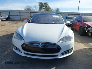 2014 Tesla Model S 60 with VIN 5YJSA1H13EFP62451, listed as a IAAI auction lot 41639068 with 88,000 mi miles and . Bid and sale history available at DreamBid. Image 12.