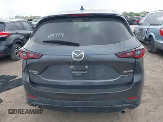 2023 Mazda CX-5 S Carbon Edition z VIN JM3KFBCM7P0226930, wystawiony jako IAAI lot #41939956 z przebiegiem 29 477 mil mil oraz . Historia ofert i sprzedaży dostępna na DreamBid. Obrazek 16.