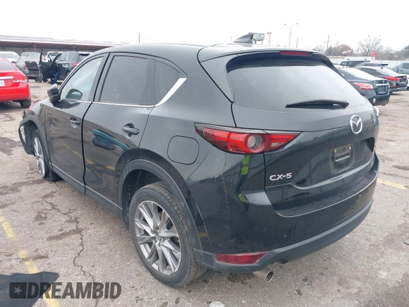 2020 Mazda CX-5 Grand Touring with VIN JM3KFADM8L0811910, listed as a IAAI auction lot 41446214 with 57,849 mi miles. Bid and sale history available at carsss.com. Image 3.