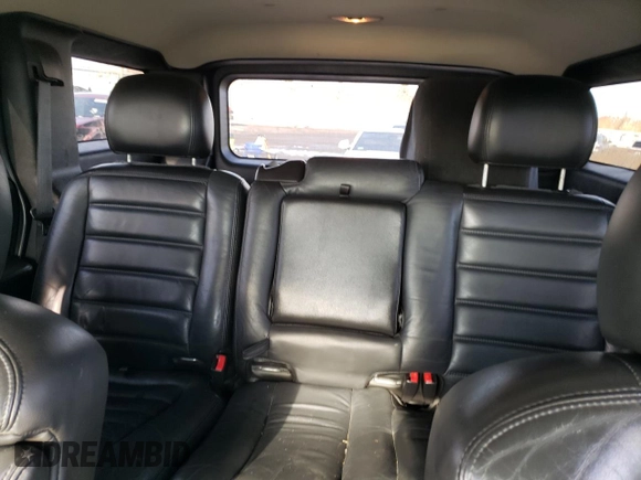 2005 Hummer H2 SUV with VIN 5GRGN23U35H111403, listed as a Copart auction lot 84720994 with 142,159 mi miles and Salvage Title. Bid and sale history available at carsss.com. Image 10.