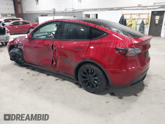 2024 Tesla Model Y Long Range with VIN 7SAYGAEE2RF986206, listed as a IAAI auction lot 42177852 with 14,399 mi miles and . Bid and sale history available at DreamBid. Image 3.