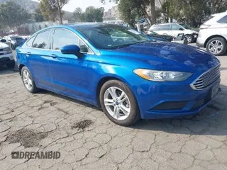 2018 Ford Fusion SE z VIN 3FA6P0H73JR187412, wystawiony jako IAAI lot #42020077 z przebiegiem 94 739 mil mil oraz . Historia ofert i sprzedaży dostępna na DreamBid. Obrazek 1.