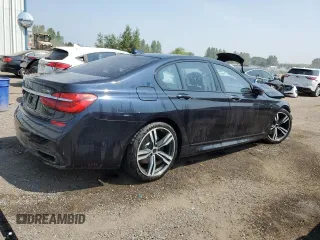 2017 BMW 7 Series 750i xDrive with VIN WBA7B0C57HG527064, listed as a Copart auction lot 62463405 with 103,454 mi miles and Salvage title. Bid and sale history available at DreamBid. Image 3.