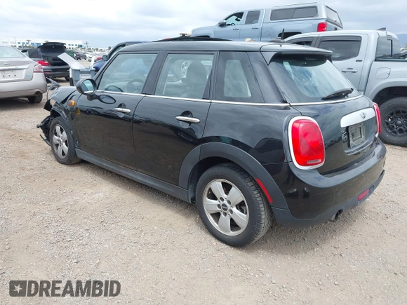 2015 MINI Hardtop 4 Door z VIN WMWXS5C58FT831568, wystawiony jako IAAI lot #42129819 z przebiegiem 76 044 mil mil oraz . Historia ofert i sprzedaży dostępna na DreamBid. Obrazek 3.