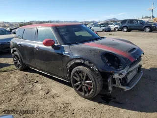 2020 MINI Clubman John Cooper Works with VIN WMWJZ9C06L2M15100, listed as a Copart auction lot 77621744 with 21,705 mi miles and Salvage Title. Bid and sale history available at carsss.com. Image 4.