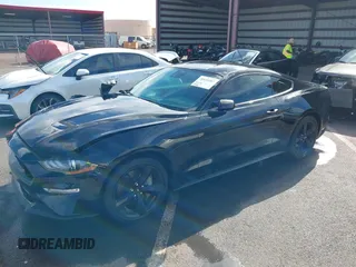 2021 Ford Mustang GT z VIN 1FA6P8CF1M5147740, wystawiony jako IAAI lot #38920487 z przebiegiem 15 299 mil mil oraz . Historia ofert i sprzedaży dostępna na DreamBid. Obrazek 2.