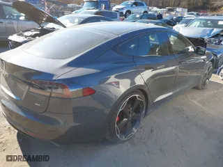 2016 Tesla Model S 90D with VIN 5YJSA1E23GF129903, listed as a IAAI auction lot 41028744 with 112,183 mi miles. Bid and sale history available at carsss.com. Image 4.