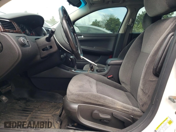 2014 Chevrolet Impala LT with VIN 2G1WB5E31E1154130, listed as a Copart auction lot 54212785 with 150,169 mi miles and Salvage title. Bid and sale history available at DreamBid. Image 7.