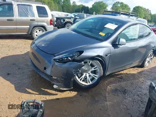 2023 Tesla Model Y Long Range with VIN 7SAYGDEE2PF674286, listed as a IAAI auction lot 42010275 with Not Provided miles and . Bid and sale history available at carsss.com. Image 2.