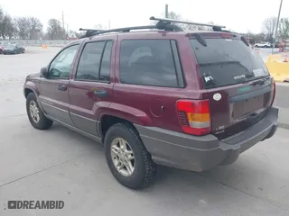 2003 Jeep Grand Cherokee Laredo with VIN 1J4GW48S83C563627, listed as a IAAI auction lot 41910225 with 150,264 mi miles. Bid and sale history available at carsss.com. Image 3.