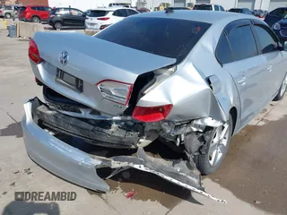 2014 Volkswagen Jetta TDI w/Premium with VIN 3VWLL7AJ6EM424935, listed as a IAAI auction lot 41533634 with 64,028 mi miles and . Bid and sale history available at DreamBid. Image 6.