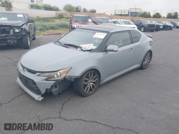 2014 Scion tC with VIN JTKJF5C71E3077886, listed as a IAAI auction lot 41939128 with 138,845 mi miles. Bid and sale history available at carsss.com. Image 2.