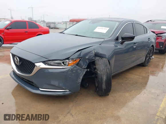 2021 Mazda 6 Carbon Edition with VIN JM1GL1WY0M1600414, listed as a IAAI auction lot 41551393 with 36,780 mi miles and . Bid and sale history available at DreamBid. Image 2.