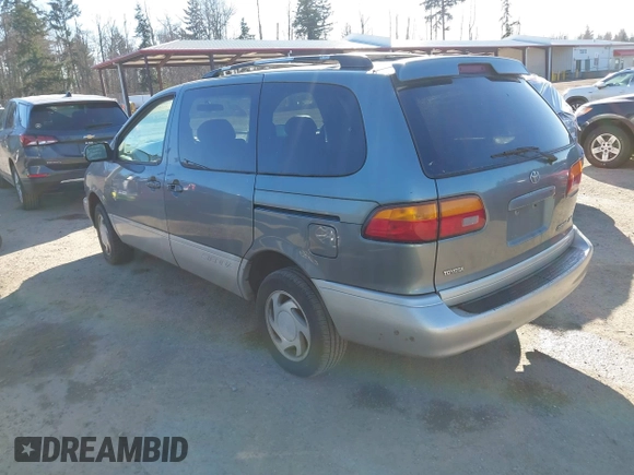 1999 Toyota Sienna LE with VIN 4T3ZF13C3XU103436, listed as a IAAI auction lot 41667242 with 228,318 mi miles. Bid and sale history available at carsss.com. Image 3.