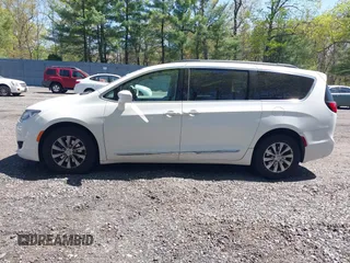 2017 Chrysler Pacifica Touring L with VIN 2C4RC1BG0HR821230, listed as a IAAI auction lot 42158120 with 98,354 mi miles and . Bid and sale history available at DreamBid. Image 14.