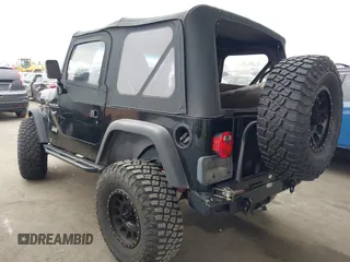 2002 Jeep Wrangler Sport with VIN 1J4FA49S02P705470, listed as a IAAI auction lot 42477770 with 59,395 mi miles and . Bid and sale history available at DreamBid. Image 3.