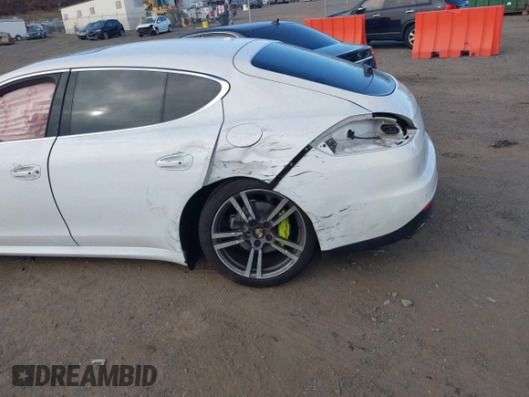 2014 Porsche Panamera S E-Hybrid with VIN WP0AD2A76EL044722, listed as a IAAI auction lot 40716615 with 52,474 mi miles and . Bid and sale history available at DreamBid. Image 6.