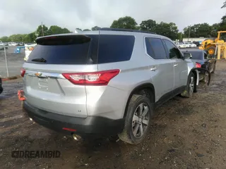 2021 Chevrolet Traverse LT with VIN 1GNERHKW6MJ157311, listed as a IAAI auction lot 42256458 with 97,635 mi miles and . Bid and sale history available at DreamBid. Image 4.