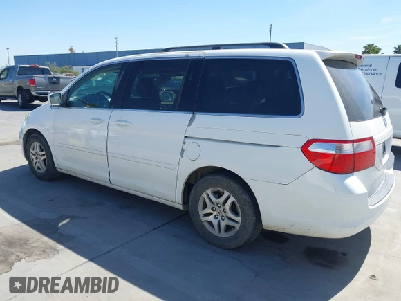 2005 Honda Odyssey EX-L with VIN 5FNRL38605B045246, listed as a IAAI auction lot 42183883 with 164,072 mi miles and . Bid and sale history available at carsss.com. Image 3.