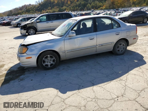 2005 Hyundai Accent GLS with VIN KMHCG45C75U638812, listed as a Copart auction lot 77968234 with 130,815 mi miles and Salvage Title. Bid and sale history available at carsss.com. Image 1.