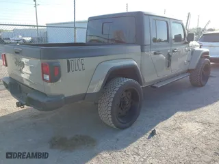 2020 Jeep Gladiator Sport S with VIN 1C6HJTAG3LL214469, listed as a IAAI auction lot 42017170 with 114,599 mi miles. Bid and sale history available at carsss.com. Image 4.