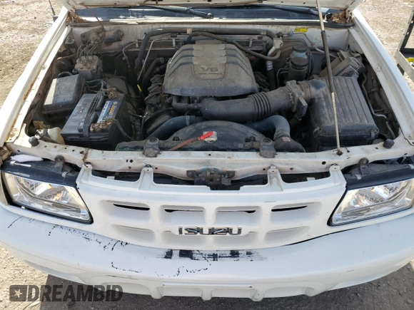2000 Isuzu Rodeo S z VIN 4S2CK58W2Y4317915, wystawiony jako Copart lot #81780094 z przebiegiem 158 217 mil mil oraz Szkoda całkowita • Salvage title. Historia ofert i sprzedaży dostępna na DreamBid. Obrazek 12.