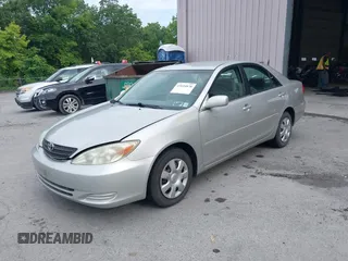 2004 Toyota Camry LE with VIN 4T1BE32K14U857478, listed as a IAAI auction lot 42654878 with 210,542 mi miles and . Bid and sale history available at DreamBid. Image 2.