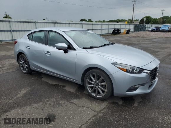 2018 Mazda 3 Touring z VIN 3MZBN1V38JM206424, wystawiony jako Copart lot #57914015 z przebiegiem 93 095 mil mil oraz Szkoda całkowita • Salvage title. Historia ofert i sprzedaży dostępna na DreamBid. Obrazek 4.