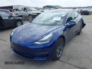2019 Tesla Model 3 Mid Range with VIN 5YJ3E1EA5KF190453, listed as a IAAI auction lot 41880684 with 58,909 mi miles and . Bid and sale history available at carsss.com. Image 2.