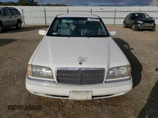 1995 Mercedes-Benz C with VIN WDBHA28E1SF151911, listed as a Copart auction lot 76814424 with 128,184 mi miles and Clean Title. Bid and sale history available at carsss.com. Image 5.