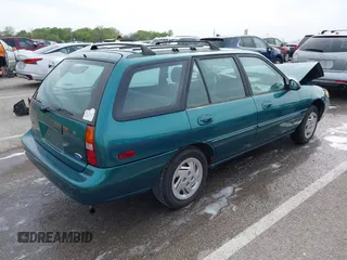 1997 Ford Escort LX with VIN 3FALP15P1VR169817, listed as a IAAI auction lot 42094673 with 111,762 mi miles. Bid and sale history available at carsss.com. Image 4.