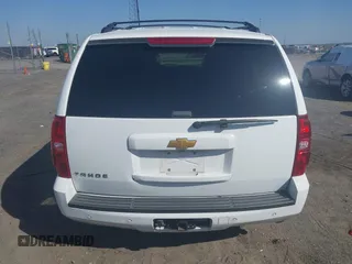 2014 Chevrolet Tahoe LT with VIN 1GNSCBE06ER233105, listed as a IAAI auction lot 41753190 with 161,056 mi miles and . Bid and sale history available at DreamBid. Image 16.