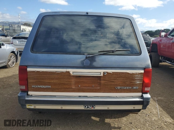1987 Plymouth Voyager z VIN 2P4FH51G8HR130018, wystawiony jako Copart lot #47295285 z przebiegiem 68 113 mil mil oraz Tytuł czysty. Historia ofert i sprzedaży dostępna na DreamBid. Obrazek 6.