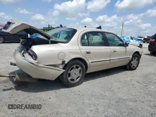 2001 Lincoln Continental z VIN 1LNHM97V91Y622267, wystawiony jako Copart lot #59915445 z przebiegiem 77 070 mil mil oraz Szkoda całkowita • Salvage title. Historia ofert i sprzedaży dostępna na DreamBid. Obrazek 3.