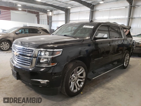 2019 Chevrolet Suburban Premier with VIN 1GNSKJKJ8KR302849, listed as a Copart auction lot 87717275 with 69,498 mi miles and Salvage Title. Bid and sale history available at DreamBid. Image 1.
