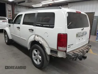 2007 Dodge Nitro SLT with VIN 1D8GU58K97W583408, listed as a IAAI auction lot 41653696 with 124,449 mi miles. Bid and sale history available at carsss.com. Image 3.