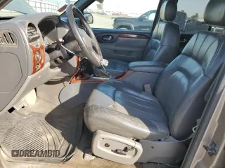 2003 GMC Envoy SLE with VIN 1GKDS13S332390989, listed as a Copart auction lot 74729104 with 127,680 mi miles and Salvage Title. Bid and sale history available at carsss.com. Image 7.
