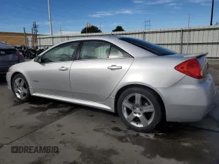 2009 Pontiac G6 with VIN 1G2ZL577094232011, listed as a Copart auction lot 77175054 with 133,353 mi miles and Salvage title. Bid and sale history available at DreamBid. Image 2.