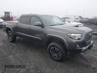 2021 Toyota Tacoma 4WD SR5 with VIN 3TMDZ5BN4MM099423, listed as a IAAI auction lot 41208397 with 62,935 mi miles. Bid and sale history available at carsss.com. Image 1.
