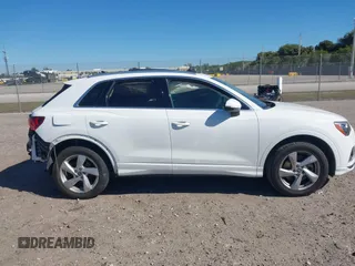 2021 Audi Q3 Premium with VIN WA1AUCF32M1097059, listed as a IAAI auction lot 41825132 with 66,144 mi miles and . Bid and sale history available at DreamBid. Image 13.