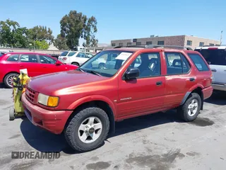 1999 Isuzu Rodeo S z VIN 4S2CK58W4X4362837, wystawiony jako IAAI lot #42403621 z przebiegiem 177 690 mil mil oraz . Historia ofert i sprzedaży dostępna na DreamBid. Obrazek 6.