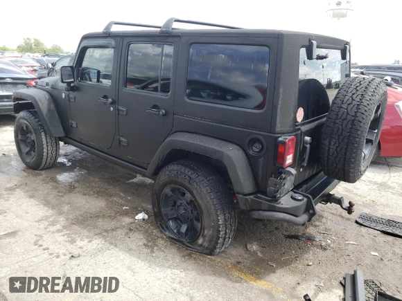 2013 Jeep Wrangler Unlimited Rubicon 10th Anniversary with VIN 1C4HJWFGXDL543660, listed as a Copart auction lot 61462104 with 115,897 mi miles and Salvage title. Bid and sale history available at DreamBid. Image 2.