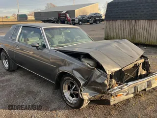 1987 Buick Regal with VIN 1G4GJ11Y4HP413978, listed as a Copart auction lot 87311954 with 52,519 mi miles and Salvage Title. Bid and sale history available at DreamBid. Image 1.